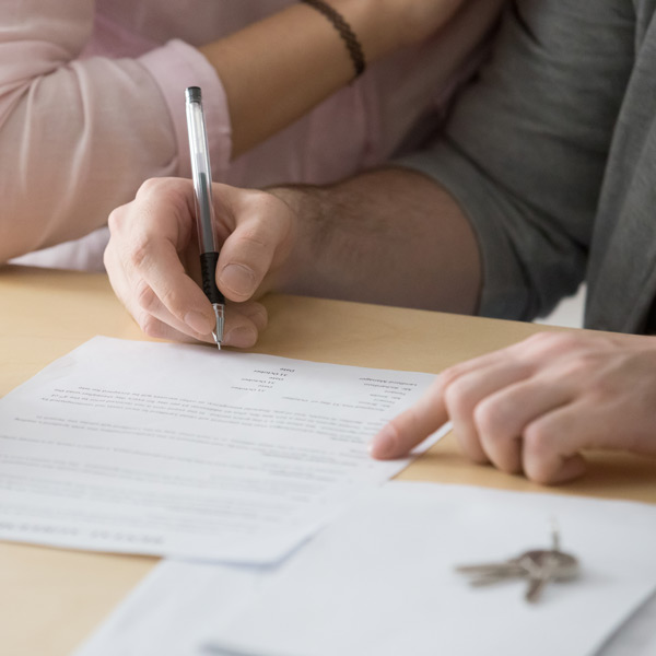 man signing paperwork